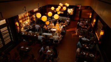 A person eating at a cozy cafe indoors.